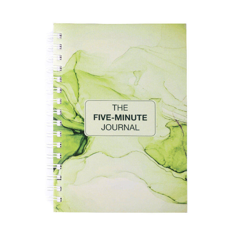 A spiral hardcover notebook with a green marbled design and the title 'THE FIVE-MINUTE JOURNAL' displayed on the cover.
