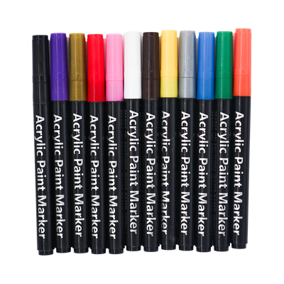 Set of acrylic paint markers in various colors on a white background