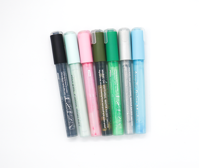 Set of six colourful Acrylic markers on a white background