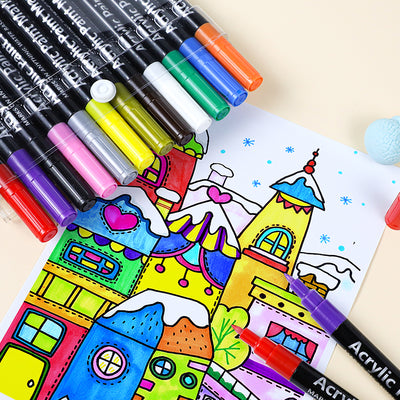 Colorful acrylic paint pens with a partially colored illustration of a cartoon city.