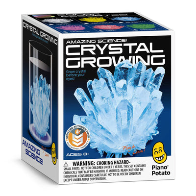 Box of Piano Potato crystal growing kit with blue crystals and warning label.