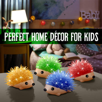 Four completed crystal hedgehogs in yellow, green, blue, and red displayed as decorative accessories in a child's bedroom.