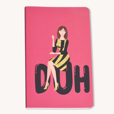 A pink notebook with a quirky illustration of a character sitting on a large letter 'U' on the cover.