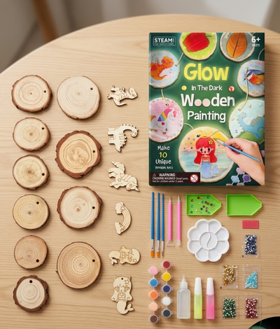 Glow in the Dark Wooden Painting kit with wooden pieces, paintbrushes, and paints on a wooden table.