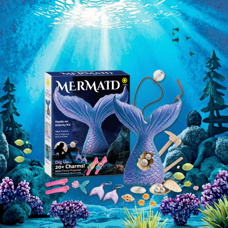 A Magical Mermaid Hands-on Activity Kit displayed against a vibrant underwater ocean background with coral and sunbeams. The image shows the product box, a large purple mermaid tail dig block, and various finished jewelry pieces like earrings and hair clips.