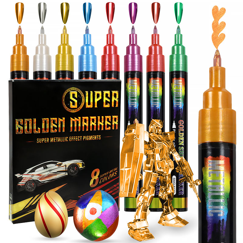 Super Golden Marker set with metallic effect markers, packaging, and decorative items.
