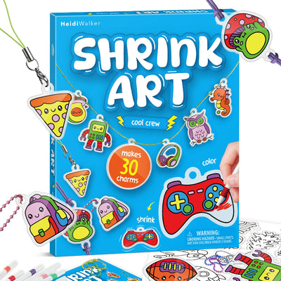 Front packaging of the HeidiWalker Shrink Art Kit ("Cool Crew" edition) showing pre-cut charms like pizza, game controllers, and animals along with colourful chains.
