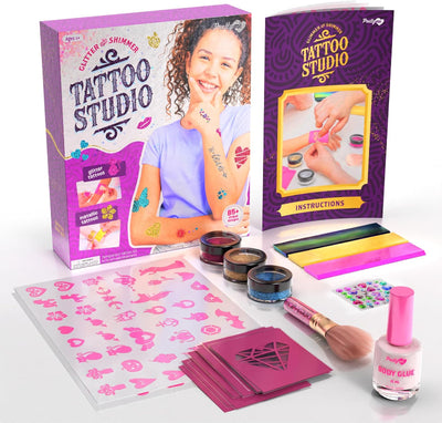 The complete unboxed tattoo studio set arranged alongside the open instruction booklet and retail box.