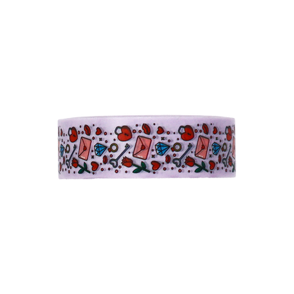 A delightful pattern of keys, lockets, roses, and diamonds on Washi tape