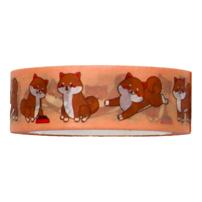 the foxes are shown sitting, playing, stretching, and sleeping on Washi Tape