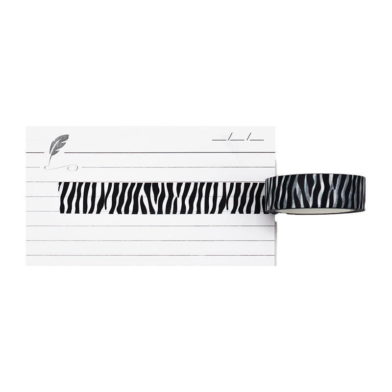 washi tape with bold Zebra Stripe Design: A classic, repeating pattern of black and white animal print stripes.