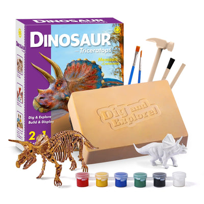 The Triceratops Activity Kit box displayed alongside a finished skeleton model, a white unpainted figure, the "Dig and Explore" plaster block, and painting supplies.